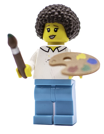 Lego minifigure of a lady wearing a Bob Ross wig and holding a paintbrush and an palette